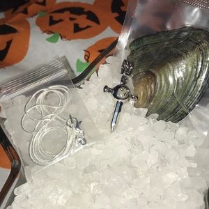 Sword pearl cage with chain and oyster